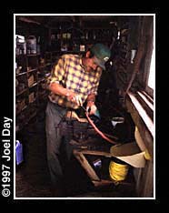 Herb Garber repairing farming tools in workshed near Elizabethtown, Pennsylvania.