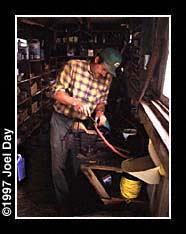 Herb Garber repairing farming tools in workshed near Elizabethtown, Pennsylvania.