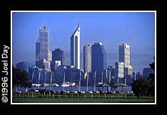 View of Perth Skyline across the Swan River through group of catamaran boats in Sir James Mitchell Park in South Perth, Western Australia.